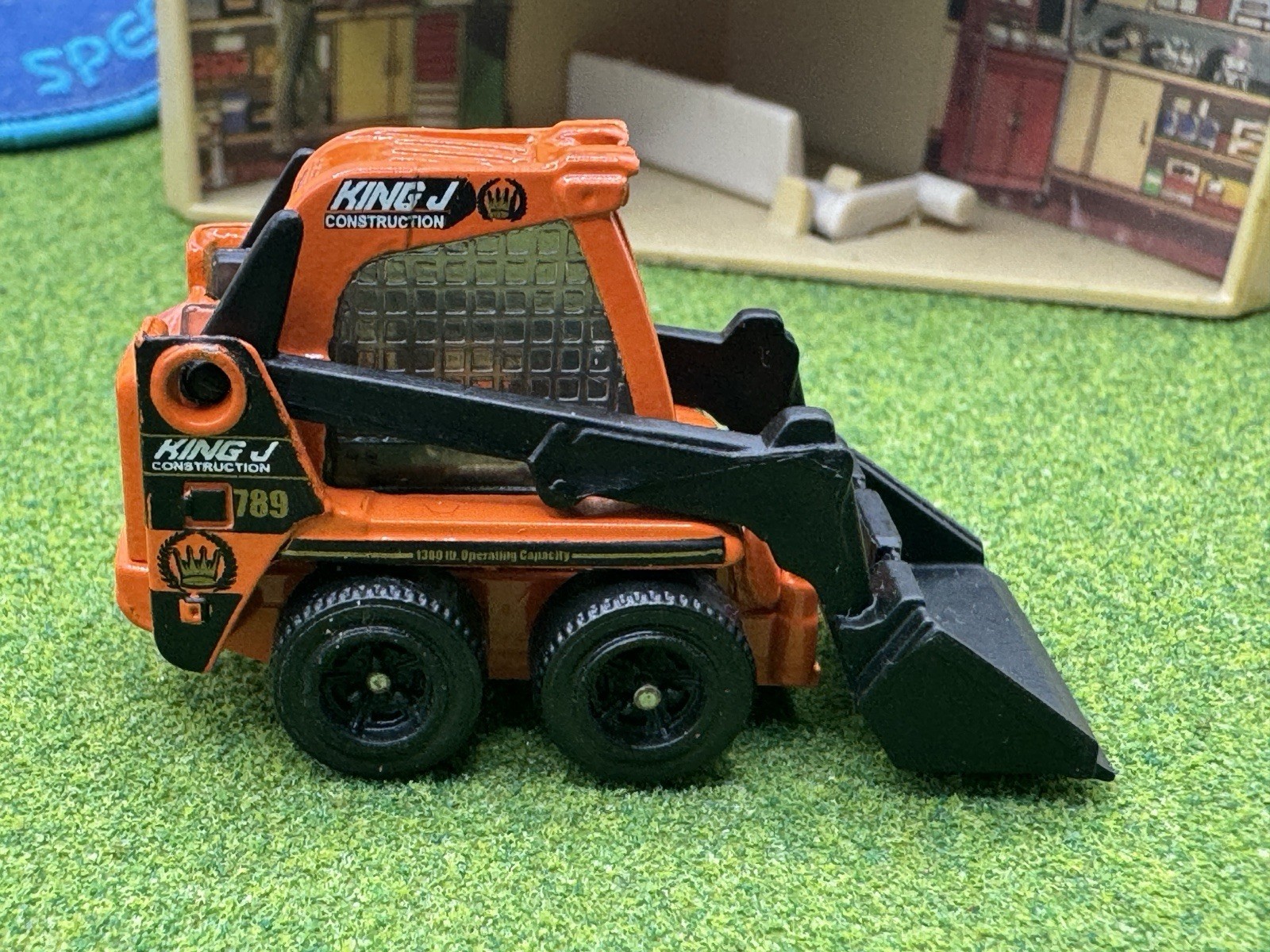 2009 Matchbox Skidster Orange KING J Bucket Construction Skid CAT Black