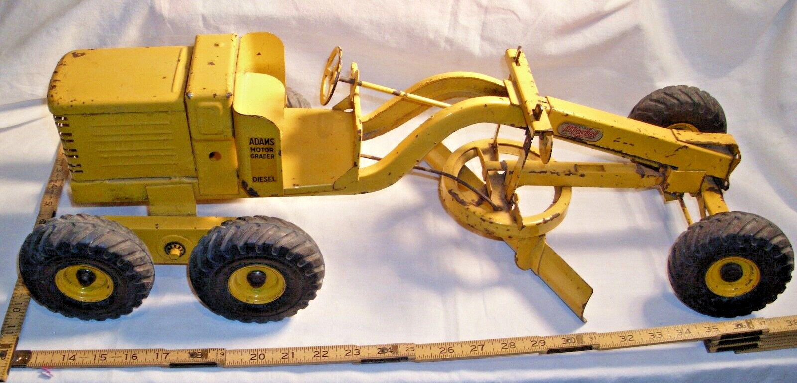 DOEPKE MODEL TOYS 1955 ADAMS MOTOR GRADER IN YELLOW PRESSED STEEL METAL TOY