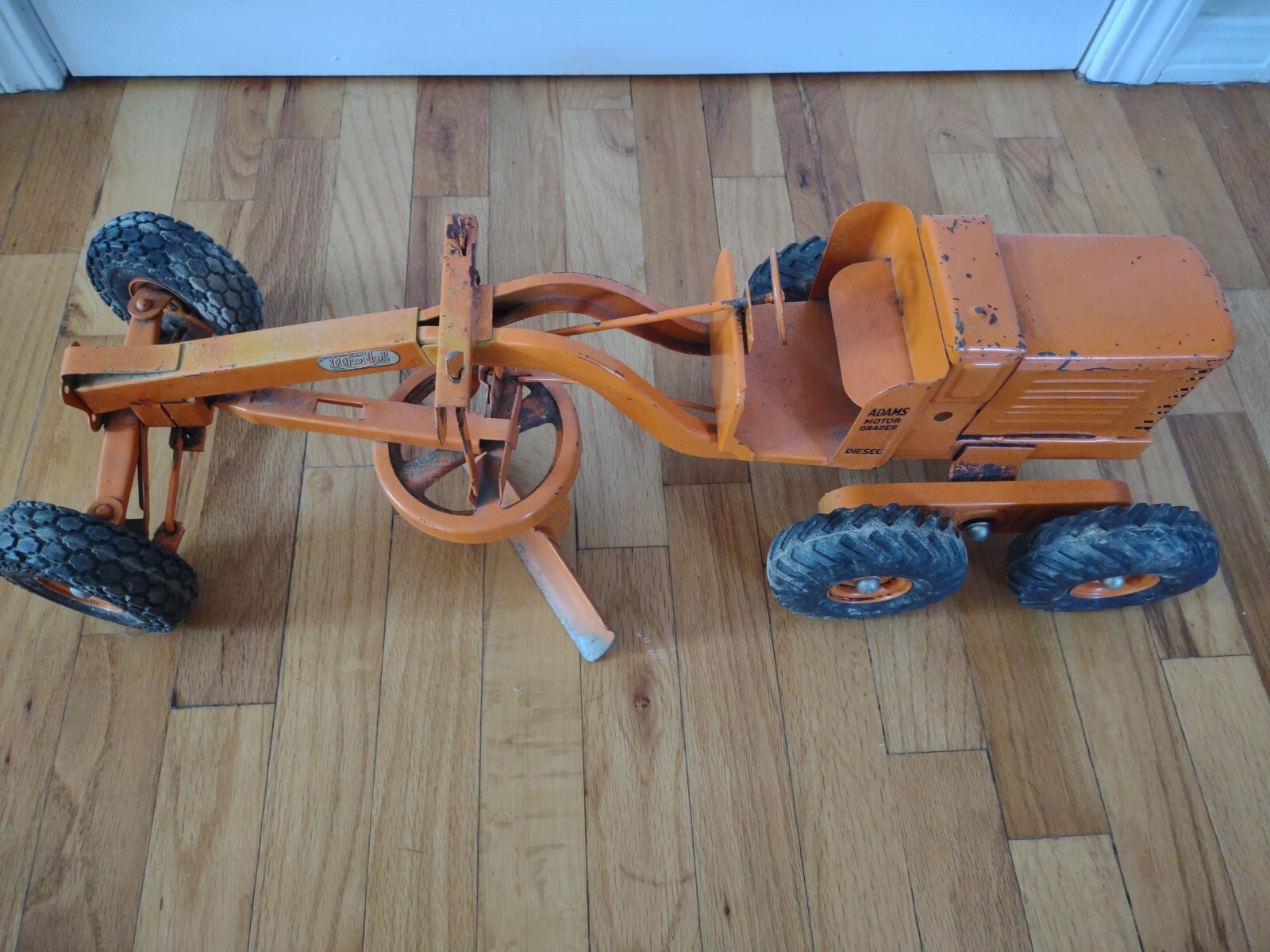 Vintage 1950&rsquo;s Model Toys Adams Road Grader Diesel motor grader orange Doepke
