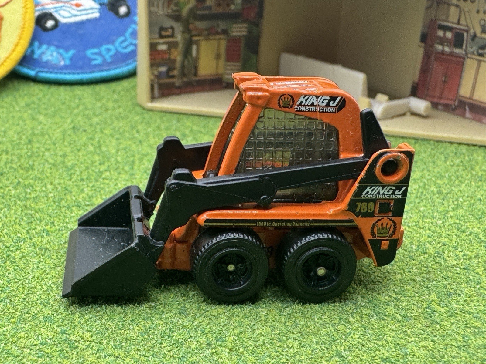2009 Matchbox Skidster Orange KING J Bucket Construction Skid CAT Black