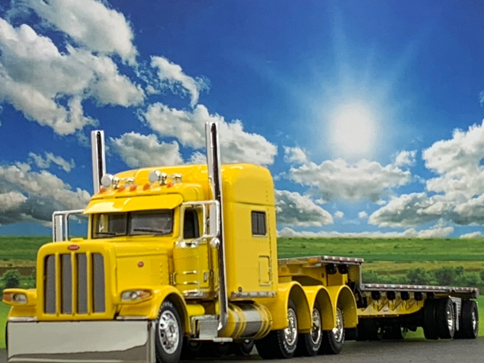 1/64 DCP PETERBILT 389 TRI AXLE W/ 70&Prime; MID ROOF & TRANSCRAFT STEPDECK TRAILER