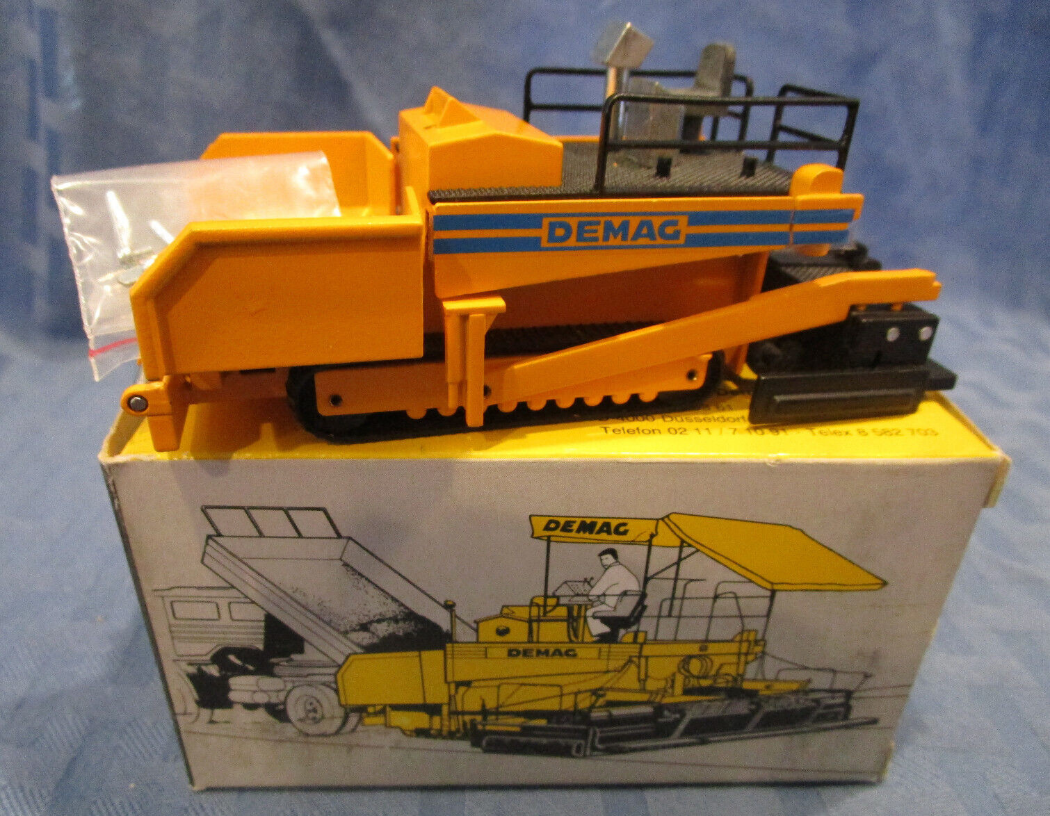 NZG Model 231, DEMAG DF120 Road Finisher, 1982, 1/50 scale, Diecast, W. Germany