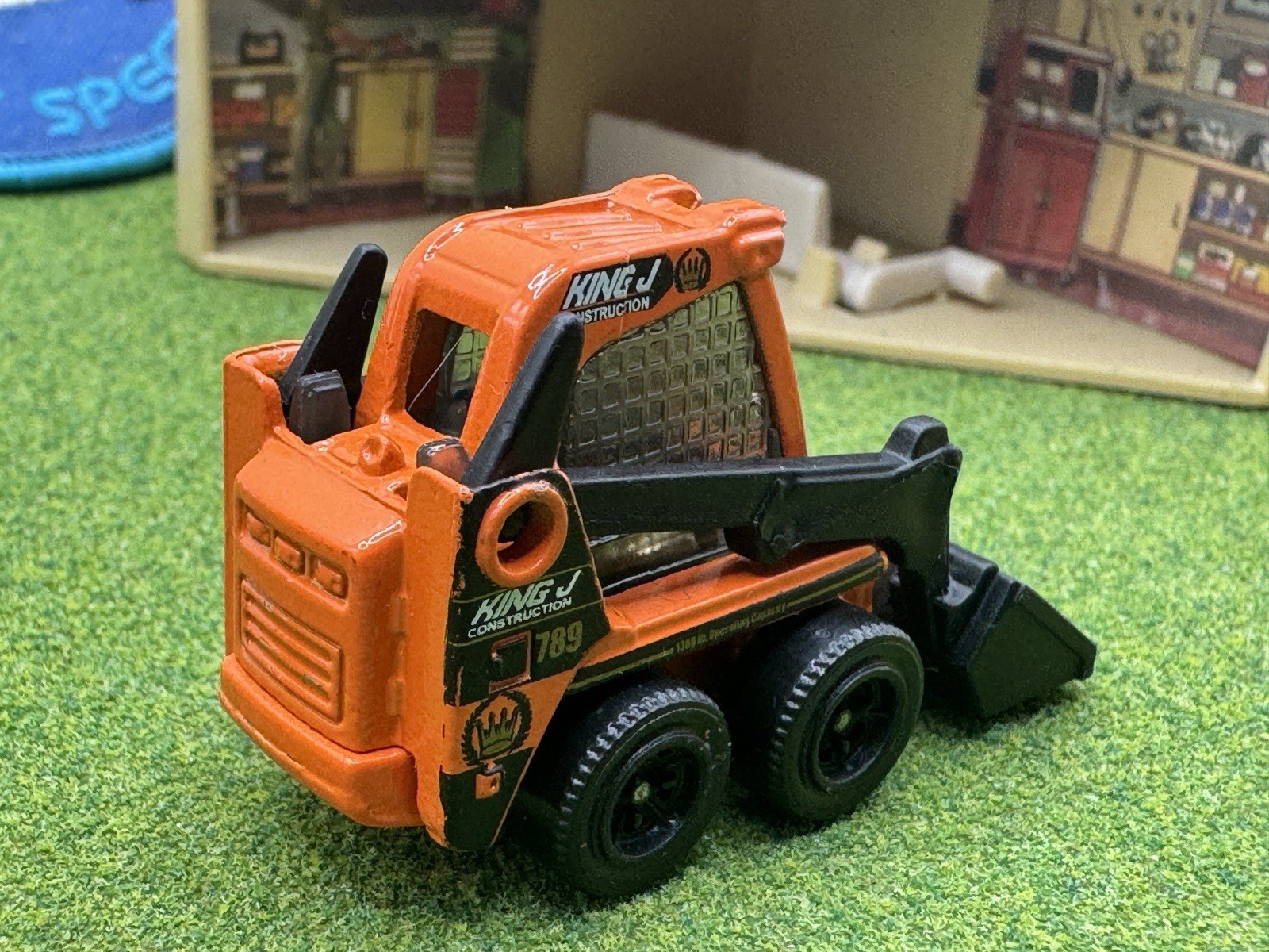 2009 Matchbox Skidster Orange KING J Bucket Construction Skid CAT Black
