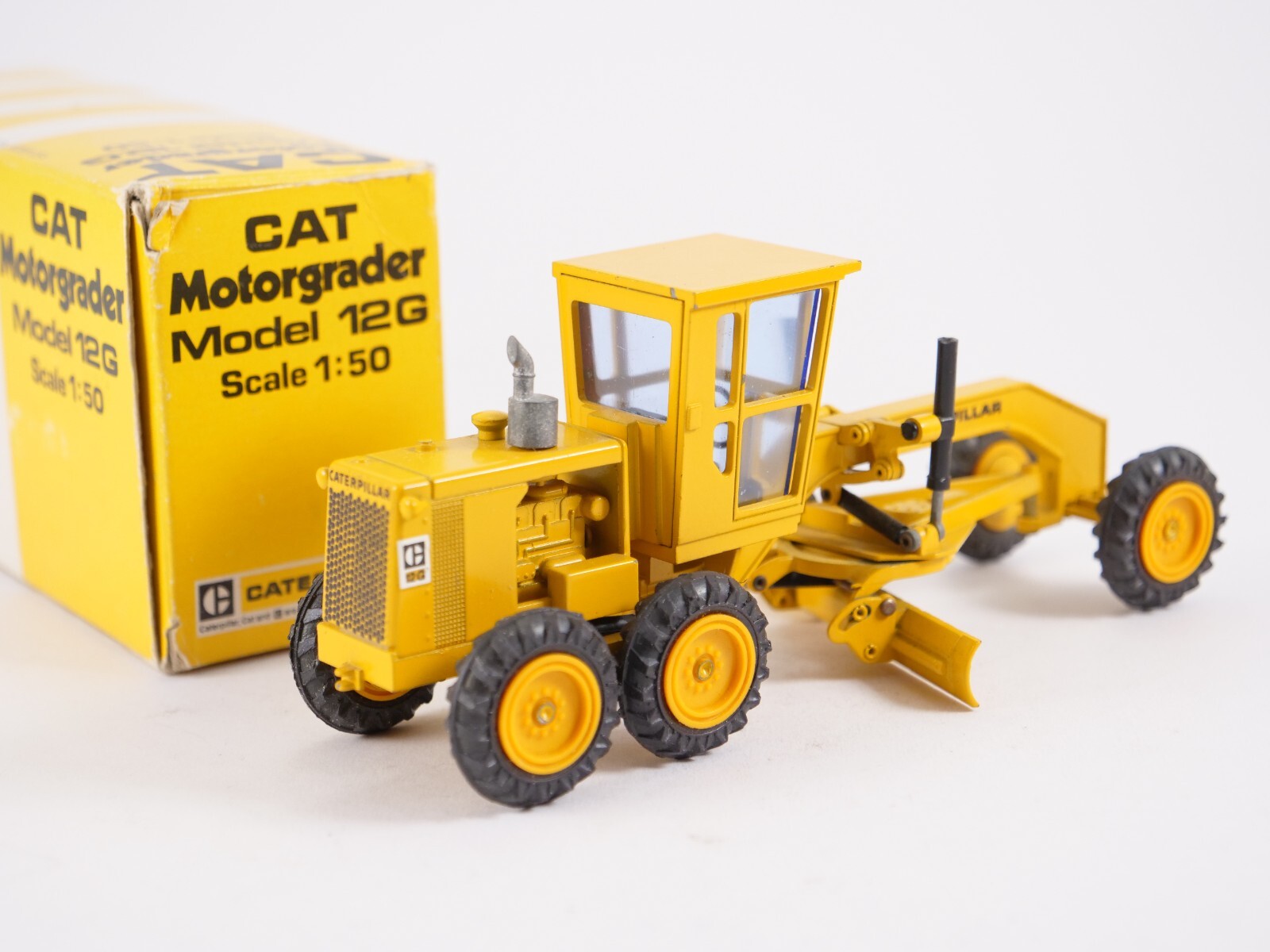NZG 150 CAT Motor Grader 12G CATERPILLAR Construction Vehicle 1:50 Yellow Box