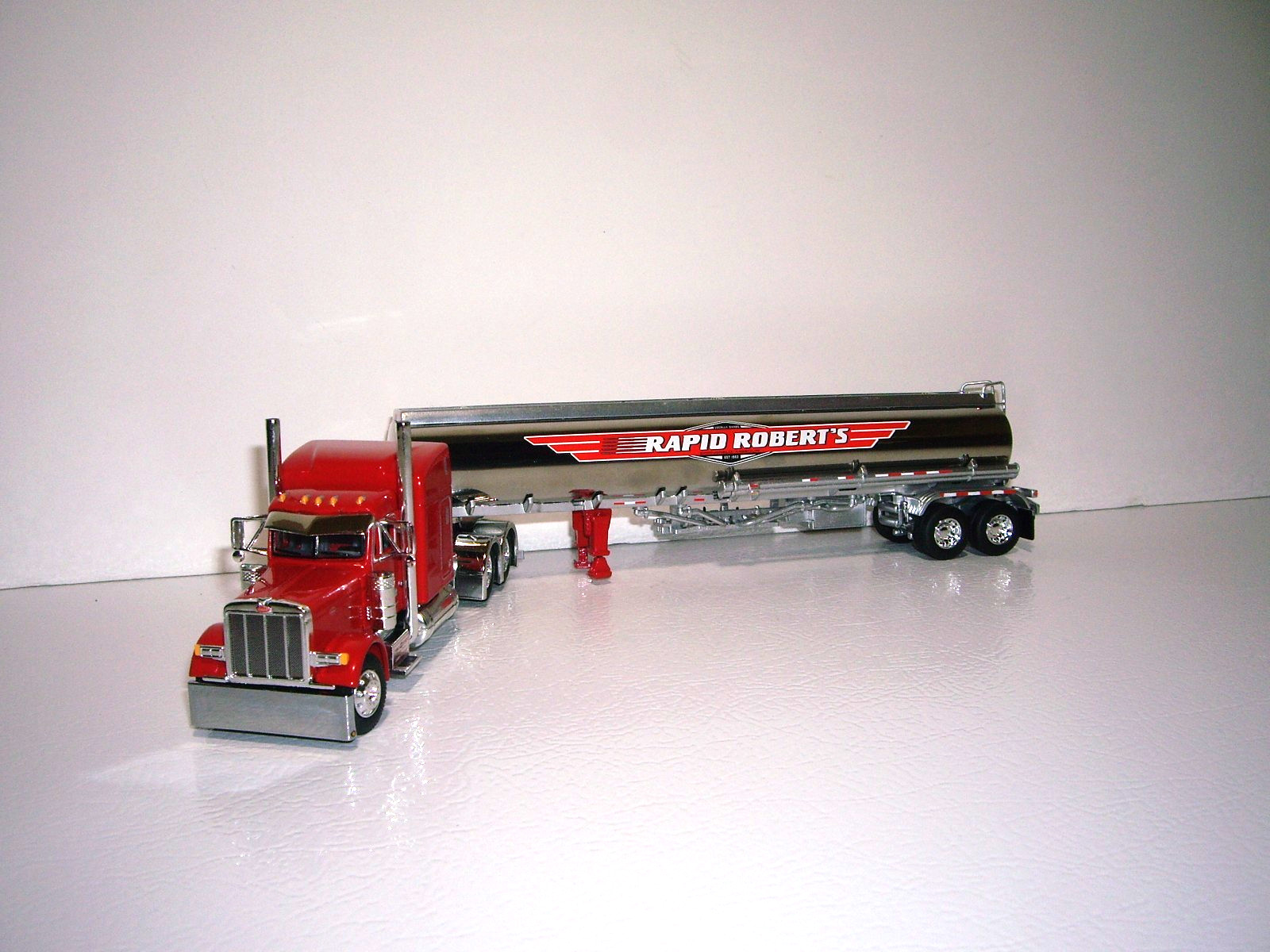 DCP FIRST GEAR 1/64 RAPID ROBERTS PETE 389 WITH 63&Prime; SLEEPER AND HEIL FUEL TANKER
