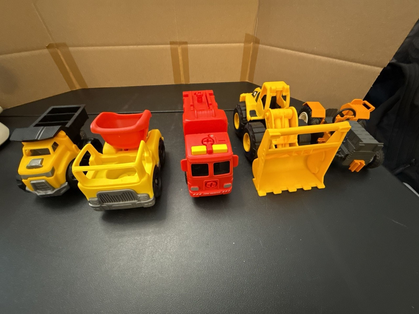 Set of 4 Assorted Construction and Emergency Vehicles (CAT Wheel Loader, Dump Tr