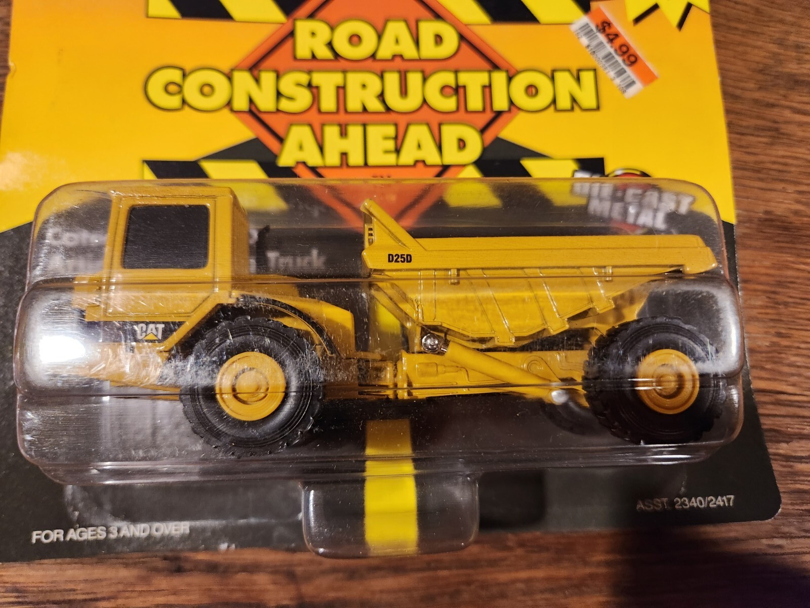 ERTL Caterpillar D25D Articulating Dump Truck Road Construction Ahead 1995
