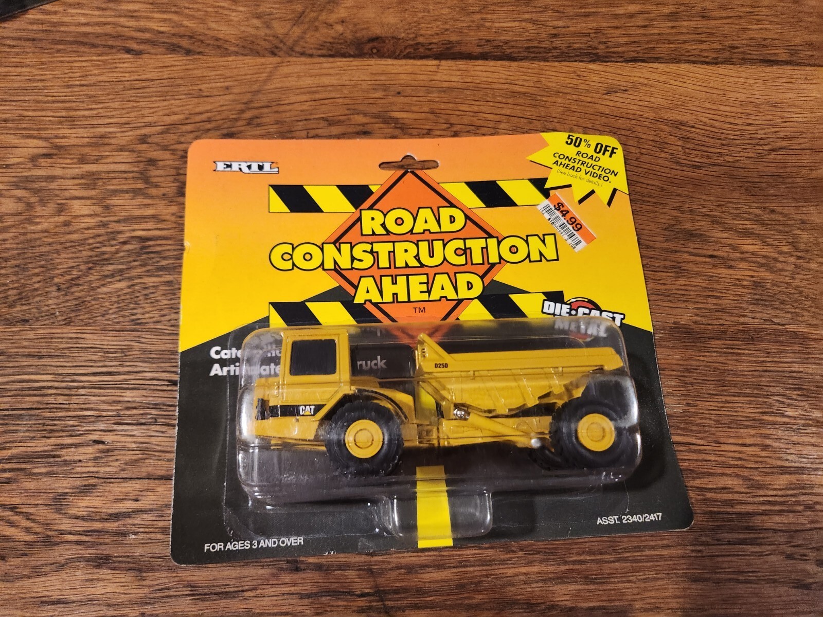 ERTL Caterpillar D25D Articulating Dump Truck Road Construction Ahead 1995