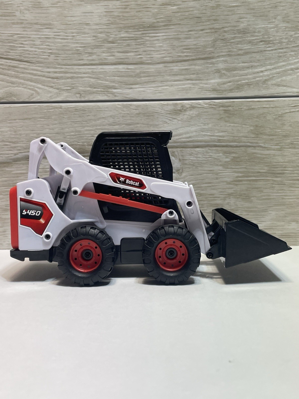 Bobcat Skid Loader Toy. Plastic.