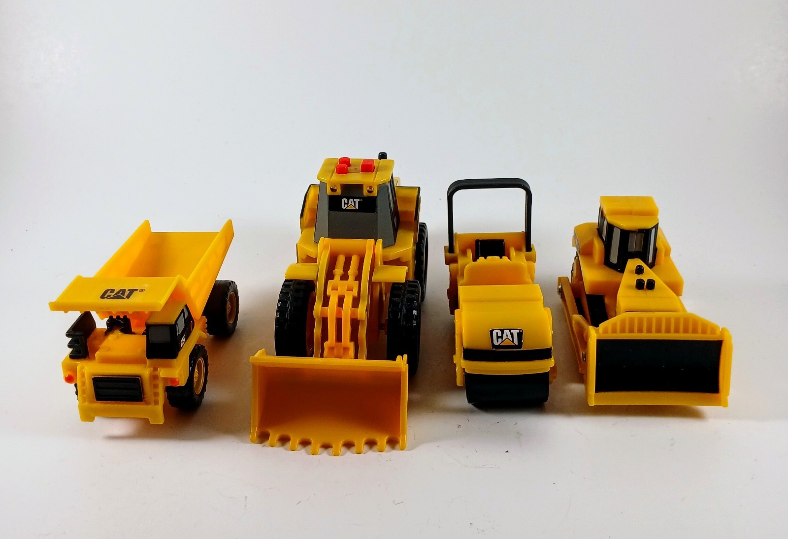 Vintage Set of 4 Caterpillar (CAT) Construction Vehicle Toys Between 2.5&Prime;-6&Prime;