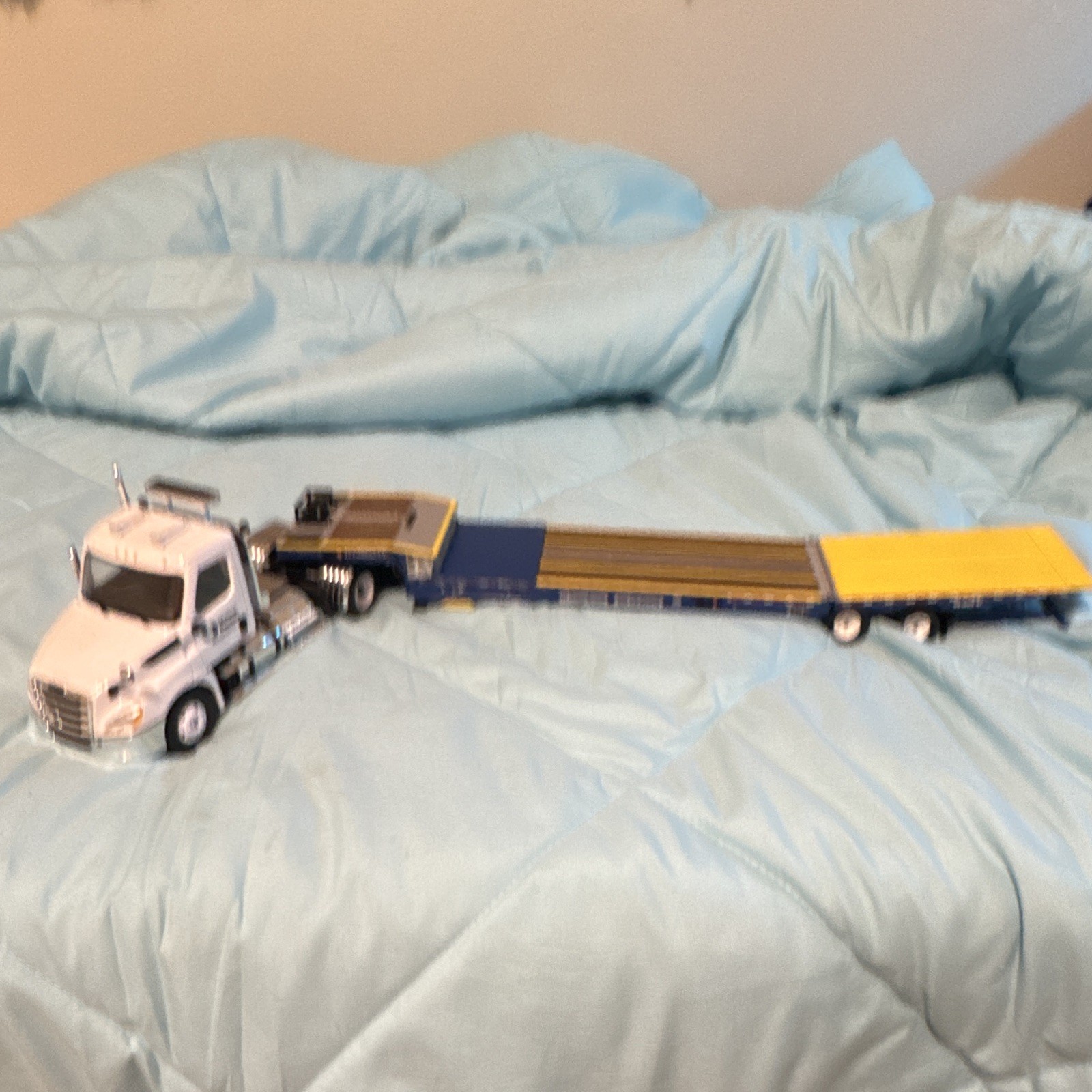 JCB White Semi Truck with Blue/Yellow Lowboy Trailer Diecast Set